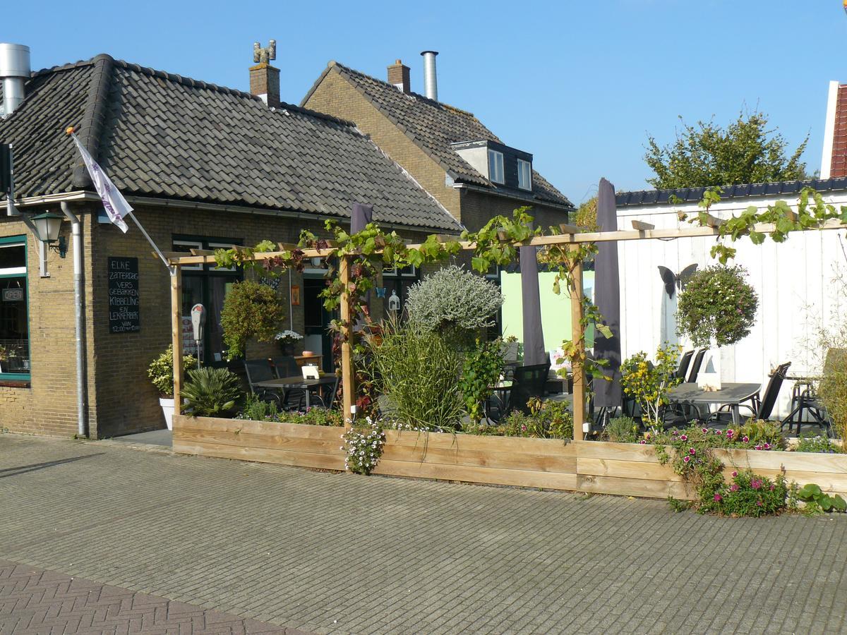 Eetcafe/Pension Nooitgedacht Strijen Bagian luar foto